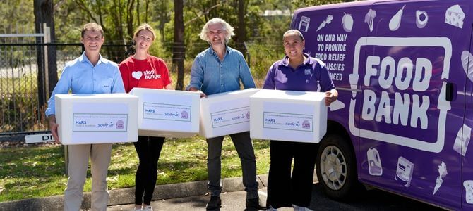 Sodexo, Foodbank and Dolmio loading prepared food into Foodbank van