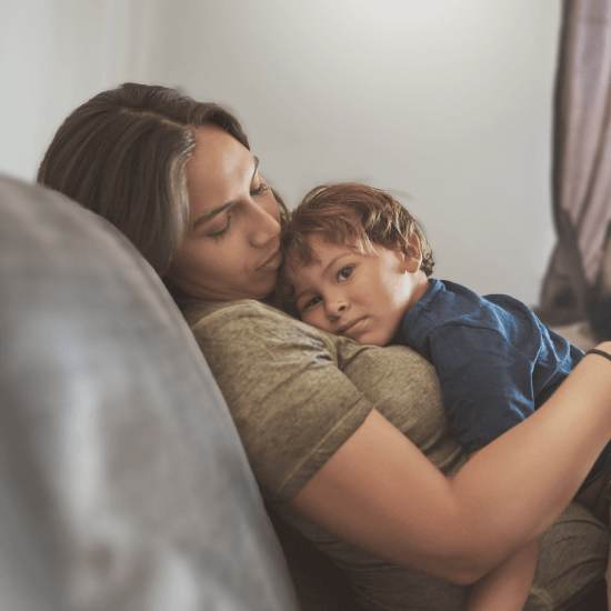 Mum and young son on couch